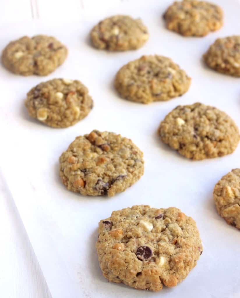 Soft & Chewy Kitchen Sink Cookies with 3 types of chocolate chips, oats, almonds, & walnuts! The possibilities are endless- crushed pretzels, crushed potato chips, chocolate-covered almonds, peanuts, peanut butter chips, and more.