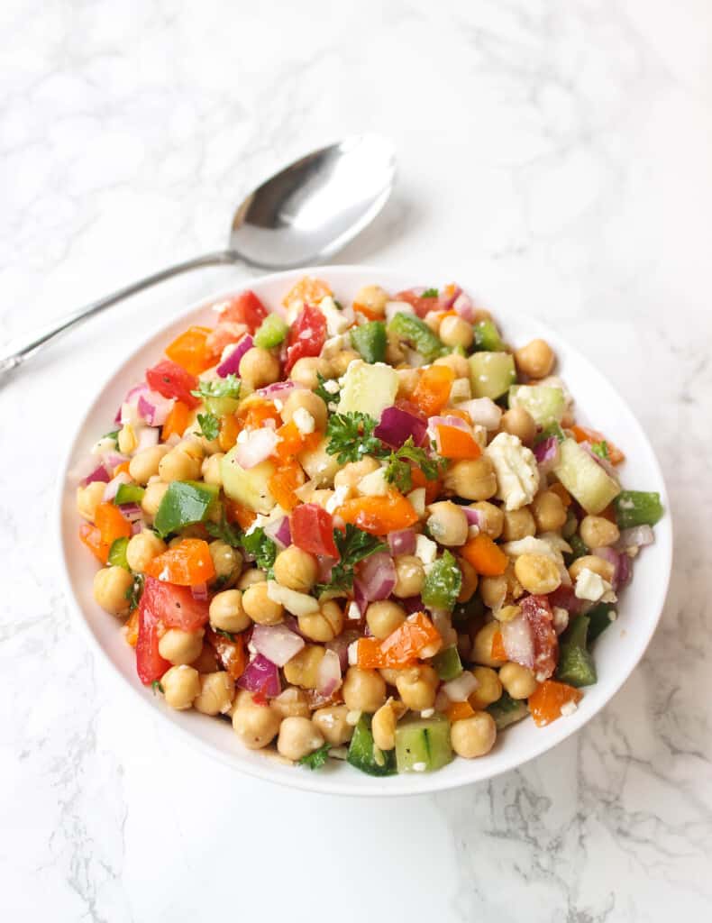 Greek Chickpea Salad LOADED with toppings - it's a simple and healthy meal to whip up! | www.healthy-liv.com