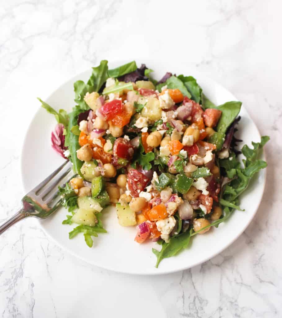 Greek Chickpea Salad LOADED with toppings - it's a simple and healthy meal to whip up! | www.healthy-liv.com