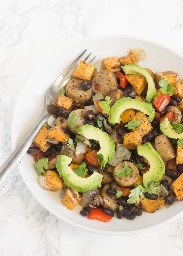 This one-pan chicken sausage sweet potato bake is an easy dinner that's delicious topped with salsa and avocado!