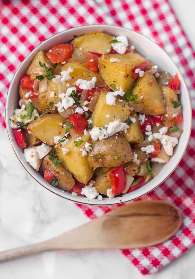 This warm roasted potato salad has a light (mayo-free!) lemon and olive oil dressing, with lots of flavor from roasted red pepper and salty feta