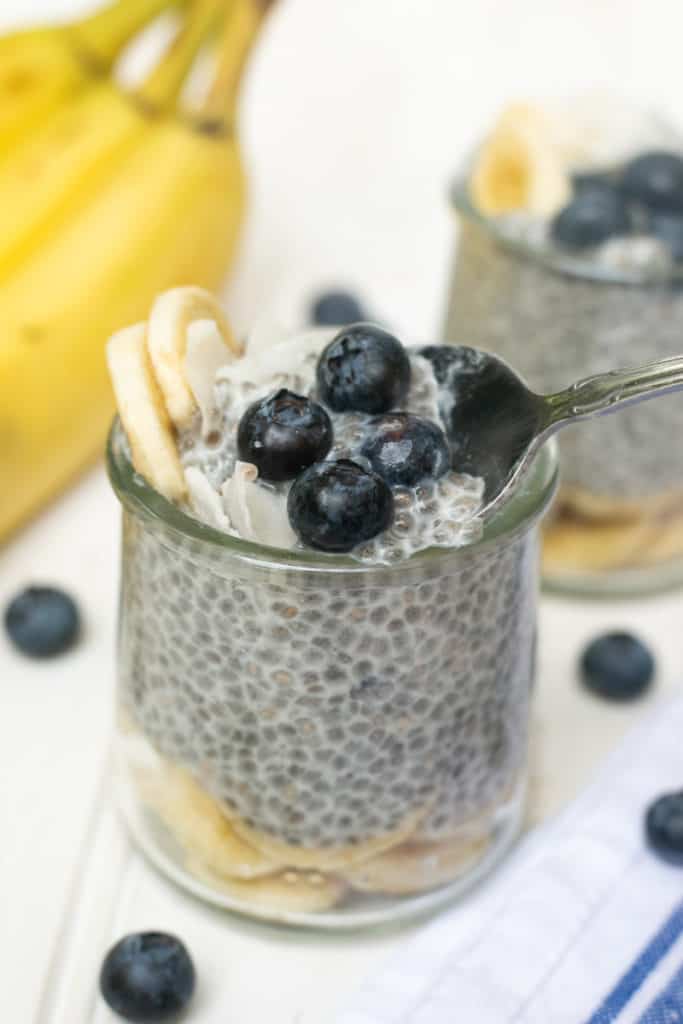 Spoonful of chia pudding in a jar